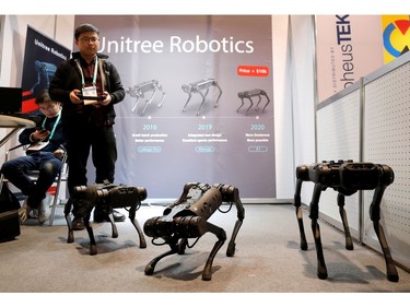 Li Chen of Unitree Robotics operates animal-inspired robots during the 2020 CES iin Las Vegas on Jan. 8, 2020.