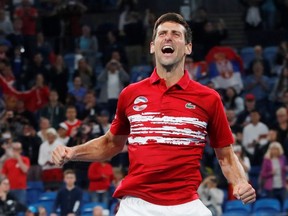 Serbia's Novak Djokovic celebrates winning the ATP Cup after winning his Final doubles match against Spain's Pablo Carreno-Busta and Feliciano Lopez  REUTERS/Ciro De Luca ORG XMIT: AI