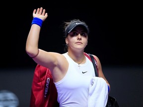 Canada's Bianca Andreescu waves after retiring injured from her match against Czech Republic's Karolina Pliskova.