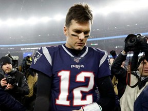 Patriots quarterback Tom Brady walks off the field after a loss to the Titans at Gillette Stadium in Foxborough, Mass., on Saturday, Jan. 4, 2020.