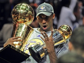 Kobe Bryant of the Los Angeles Lakers celebrates victory following Game 5 of the NBA Finals against the Orlando Magic at Amway Arena on June 14, 2009 in Orlando, Florida. The Lakers won the National Basketball Association championships defeating Orlando 99-86 for their 15th title and first since 2002. Bryant had 30 points, eight rebounds and six assists as the Lakers completed a four-games-to-one victory in the best-of-seven NBA Finals. AFP