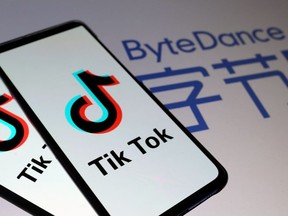 Tik Tok logos are seen on smartphones in front of a displayed ByteDance logo in this illustration taken November 27, 2019.