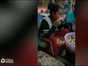 Factory workers in Thailand were caught on camera using their mouths to debone chicken feet.  (Viral Press/YouTube screengrab)