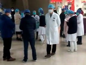 People are seen at Wuhan Union Hospital in Wuhan, China Jan. 22, 2020, in this screengrab obtained from a social media video.