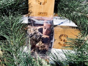 A wreath surrounds a memorial to Damian Sobieraj near the place where he died, at Hardy Park in Brockville, Ont.