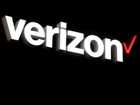 A logo sits illumintated outside the Verizon booth on day 2 of the GSMA Mobile World Congress 2019 on February 26, 2019 in Barcelona, Spain.