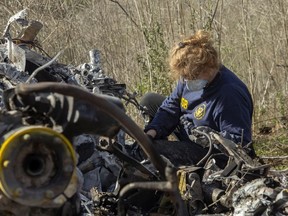 In this handout photo provided by the National Transportation Safety Board, an investigator works at the scene of the helicopter crash that killed former NBA star Kobe Bryant and his 13-year-old daughter Gianna on January 27, 2020 in Calabasas, California.