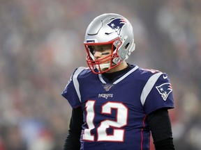 Tom Brady of the New England Patriots looks on during the first half against the Tennessee Titans in the AFC Wild Card Playoff game at Gillette Stadium on January 04, 2020 in Foxborough, Massachusetts.