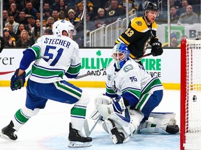 Charlie Coyle of the Boston Bruins scores in the first period of a game against the Vancouver Canucks at TD Garden on Feb. 4, 2020 in Boston.