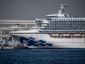 The Diamond Princess cruise ship sits docked at Daikoku Pier where it is being resupplied and newly diagnosed coronavirus cases taken for treatment as it remains in quarantine after a number of the 3,700 people on board were diagnosed with coronavirus, on February 10, 2020 in Yokohama, Japan.