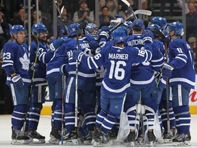 Kasperi Kapanen of the Toronto Maple Leafs is swarmed by his teammates after scoring the game winning overtime goal against the Arizona Coyotes during an NHL game at Scotiabank Arena on February 11, 2020 in Toronto, Ontario, Canada.