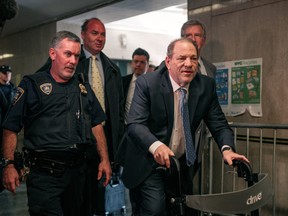 Movie producer Harvey Weinstein, right, enters New York City Criminal Court on Feb. 24, 2020 in New York City. (Scott Heins/Getty Images)