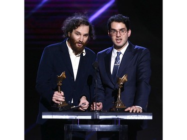 Joshua Safdie, left,  and Benjamin Safdie accept the Best Director award for "Uncut Gems" onstage during the 2020 Film Independent Spirit Awards.