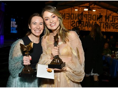 Katie Silberman, left, and Olivia Wilde, winners of Best First Feature for "Booksmart," attend the 2020 Film Independent Spirit Awards.