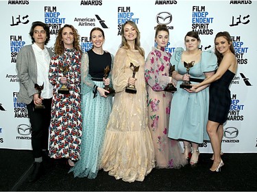 Left to right: Chelsea Barnard, Jessica Elbaum, Katie Silberman, Olivia Wilde, Kaitlyn Dever, Beanie Feldstein and Billie Lourd pose in the press room with the Best First Feature award for the film "Booksmart" during the 2020 Film Independent Spirit Awards.