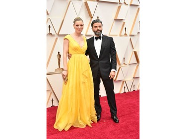 Elvira Lind and Oscar Isaac  pose on the red carpet at the 92nd Annual Academy Awards on Feb. 9, 2020 in Hollywood, Calif.