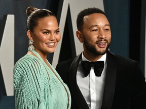 Chrissy Teigen and John Legend attend the 2020 Vanity Fair Oscar Party hosted by Radhika Jones at Wallis Annenberg Center for the Performing Arts on February 09, 2020 in Beverly Hills, California.