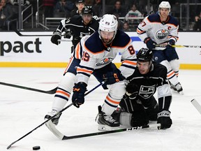Sam Gagner (89) of the Edmonton Oilers reaches for the puck in front of Matt Roy (3) of the Los Angeles Kings at Staples Center on Feb. 23, 2020, in Los Angeles, Calif.