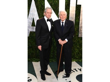 Actors Michael Douglas, left, and Kirk Douglas arrive at the 2012 Vanity Fair Oscar Party hosted by Graydon Carter at Sunset Tower on Feb. 26, 2012 in West Hollywood, Calif.