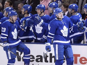 Justin Holl (right) and Travis Dermott (23), along with three other members of the 2017-18 Calder Cup-champion Toronto Marlies blue-line, have suddenly been entrusted with holding the fort on the Maple Leafs’ back end with Jake Muzzin joining Morgan Rielly and Cody Ceci on the injured list.  Frank Gunn/CP