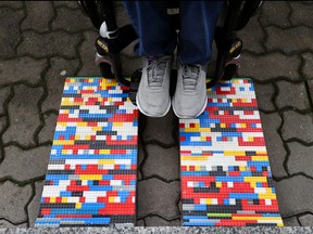 Rita Ebel, nicknamed "Lego grandma", tests one of her wheelchair ramps built from donated Lego bricks in Hanau, Germany, Feb. 17, 2020. REUTERS/Kai Pfaffenbach