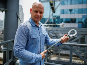 Aerialist Nik Wallenda holds a sample of a wire while he speaks with media as he prepares for a highwire walk over Times Square in New York, U.S., June 20, 2019.  (REUTERS/Eduardo Munoz/File Photo)