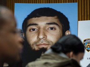 This Nov. 1, 2017, file photo shows a photo of Sayfullo Saipov displayed at a news conference at One Police Plaza in New York. (AP Photo/Craig Ruttle, File)
