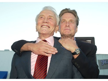 Actor Kirk Douglas, left, and son producer/actor Michael Douglas arrive at the premiere of "It Runs In The Family" at the Bruin Theater on April 7, 2003 in Los Angeles, Calif.