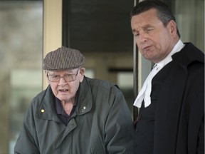 Father Robert Mackenzie, appearing for an appeal of an extradition order back to Scotland, where he faces sexual assault allegations leaves with his defence lawyer Al McIntyre in Regina on Wednesday, December 4, 2019.