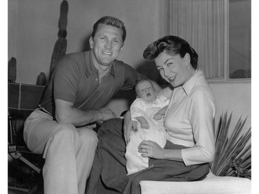 The actor Kirk Douglas with his wife Anne Buydens and their son Peter Vincent Douglas are pictured in this 1963 file photo.  (Keystone/Getty Images)