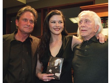 Actors Michael Douglas and Catherina Zeta-Jones introduce Kirk Douglas, during his new book 'My Stroke of Luck' promotion and signing in Toronto, Jan. 19, 2002.