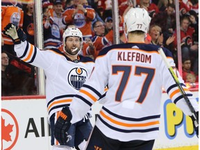 Edmonton Oilers Matt Benning and Oscar Klefbom celebrate Sam GagnerÕs goal on the Calgary Flames during NHL action in Calgary on Saturday, Feb. 1, 2020.