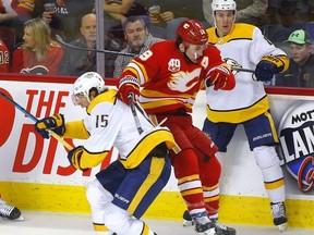 Calgary Flames, Matthew Tkachuk battles Nashville Predators, Craig Smith in first period action of at the Scotiabank Saddledome in Calgary on Thursday, Feb. 6, 2020.