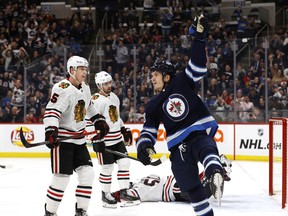 Winnipeg Jets center Jack Roslovic (28) celebrates a goal by Winnipeg Jets center Mason Appleton (82) (not shown ) in the second period against the Chicago Blackhawks at Bell MTS Place on Sunday.