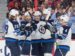 The Winnipeg Jets celebrate a goal scored by center Mark Scheifele (55) in the first period against the Ottawa Senators at the Canadian Tire Centre. Marc DesRosiers-USA TODAY Sports ORG