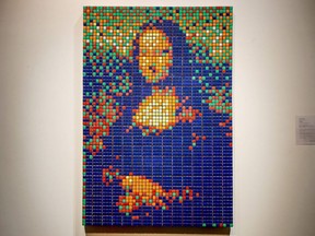 The street art Rubik's Cube version of the "Mona Lisa" entitled "Rubik Mona Lisa" made in 2005 by French artist Invader is on display at the Artcurial auction house in Paris on February 3, 2020.