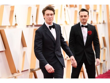 British actors George MacKay, left, and Dean-Charles Chapman arrive for the 92nd Oscars at the Dolby Theatre in Hollywood, Calif., on Feb. 9, 2020.