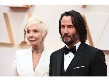 Keanu Reeves and his mother Patricia Taylor poses on the red carpet at the 92nd Annual Academy Awards on Feb. 9, 2020 in Hollywood, Calif.