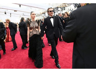 Joaquin Phoenix and Mara Rooney arrive at the red carpet at the 92nd Annual Academy Awards on Feb. 9, 2020 in Hollywood, Calif.