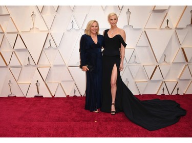 Charlize Theron and her mom Gerda Jacoba Aletta Maritz pose on the red carpet at the 92nd Annual Academy Awards on Feb. 9, 2020 in Hollywood, Calif.