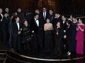 "Parasite" cast and crew accept the award for Best Picture for "Parasite" during the 92nd Oscars at the Dolby Theatre in Hollywood, California on Feb. 9, 2020. (MARK RALSTON/AFP via Getty Images)