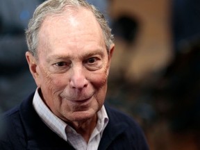 In this file photo taken on December 21, 2019 2020 Democratic presidential hopeful and former New York Mayor Michael Bloomberg talks to reporters after an event to open a campaign office at Eastern Market in Detroit, Michigan.