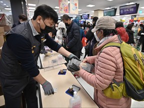 People buy face masks at a retail store in the southeastern city of Daegu on February 25, 2020. (JUNG YEON-JE/AFP via Getty Images)