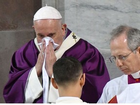 Pope Francis blows the nose as he leads the Ash Wednesday mass which opens Lent, the forty-day period of abstinence and deprivation for Christians before Holy Week and Easter, on February 26, 2020, at the Santa Sabina church in Rome.