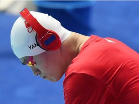 In this file photo taken on July 23, 2019 China's Sun Yang wears headphones prior to the final of the men's 200m freestyle event during the swimming competition at the 2019 World Championships at Nambu University Municipal Aquatics Center in Gwangju, South Korea.