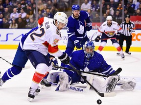 Florida Panthers moves in on Toronto Maple Leafs goaltender Frederik Andersen (31) during first period NHL hockey action in Toronto, Monday, Feb. 3, 2020.