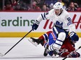 Phillip Danault of the Montreal Canadiens falls as he skates against Andreas Johnsson of the Toronto Maple Leafs at the Bell Centre on February 8, 2020 in Montreal. (Minas Panagiotakis/Getty Images)