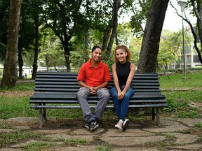 Venezuelan student John Alvarez, 20, and his girlfriend Amanda Aquino, 19, pose after an interview with AFP at Venezuela's Central University (UCV) in Caracas on Oct. 16, 2019.