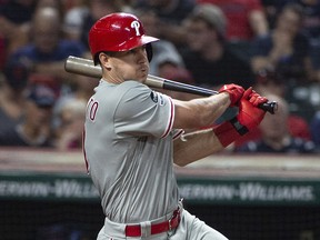 In this Sept. 21, 2019, file photo, Philadelphia Phillies' J.T. Realmuto watches his hit against the Cleveland Indians during a game in Cleveland. (AP Photo/Phil Long, File)
