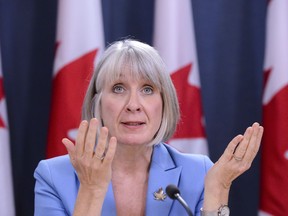 Patty Hajdu, Minister of Health, makes an announcement regarding a Bill entitled "An Act to amend the Criminal Code (medical assistance in dying)" during a press conference at the National Press Theatre in Ottawa on Monday Feb. 24, 2020. THE CANADIAN PRESS/Sean Kilpatrick